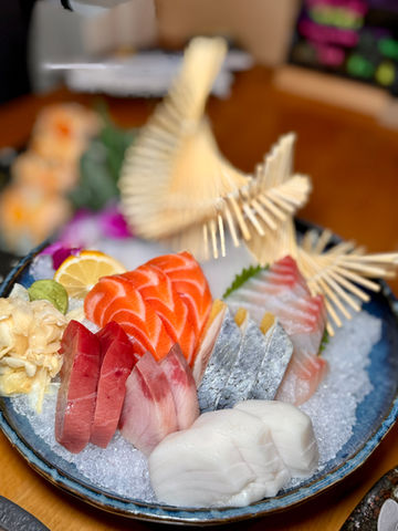 Delicious sashimi platter with fresh salmon, tuna, and Yoi Sushi.