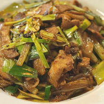 Delicious stir-fried pork with green onions, a tasty dish at Axia Chinese Bistro.