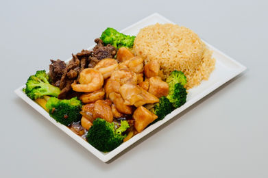 Plate with rice, broccoli, beef, shrimp, and chicken