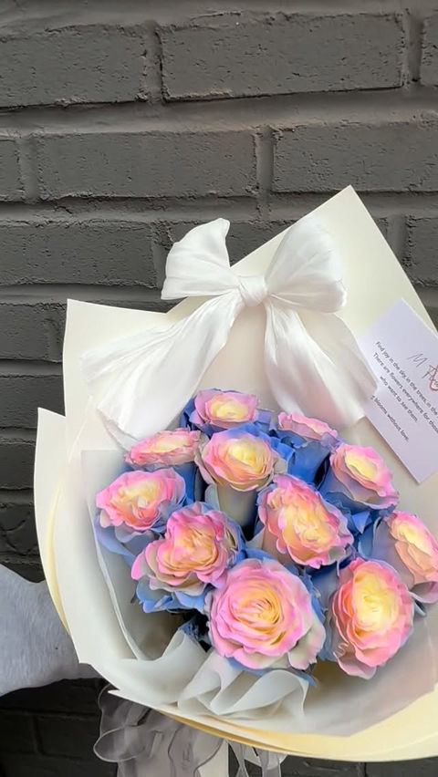 Colorful bouquet of blue and pink roses