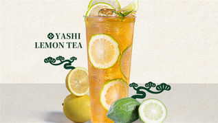 Tall glass of YASHI LEMON TEA surrounded by fresh citrus.