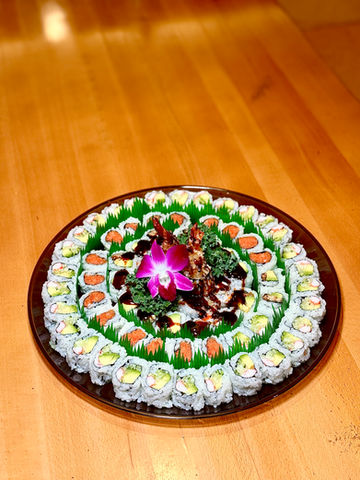 Sushi platter with rolls, arrangement, and flower decoration. Yoi Sushi