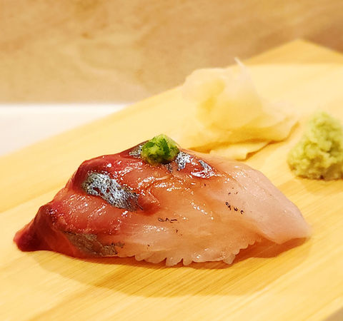 Sushi with pickled ginger and wasabi on a wooden board. Sushi The Classic