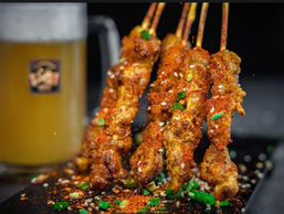 Skewered meat with seasoning and a beer, Yang Sao 杨嫂炸串
