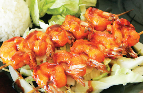Grilled teriyaki shrimp on lettuce leaves; delicious Teriyaki Plus meal.