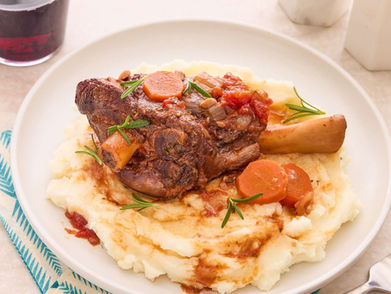 Braised lamb shank on mashed potatoes with carrots, delicious meal, NAR Restaurant