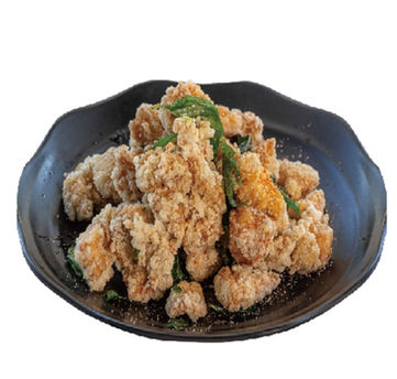 Fried chicken pieces on a black plate, early bird cafe