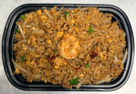 Delicious fried rice with shrimp and vegetables in a black rectangular container.