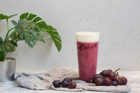 Choi M grape smoothie with grapes on a table, refreshing drink.