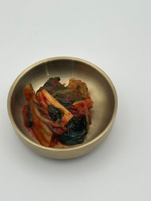 Kimchi in a brass bowl
