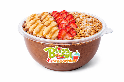 Smoothie bowl with banana, strawberry, granola, and caramel