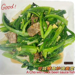 Green vegetables with Good! and Delicious text, A Cho with back been sauce fish.