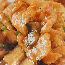 Close-up of a delicious chicken dish with mushrooms and sauce, Axia Chinese Bistro.