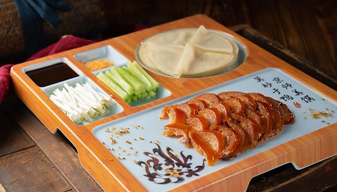 Peking duck dish with vegetables and pancakes. Axia Chinese Bistro