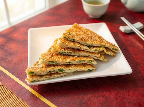 Scallion pancakes on a white plate