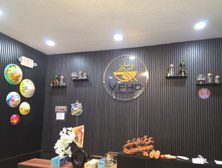 V Pho restaurant signage and decor, featuring several decorative items on display.