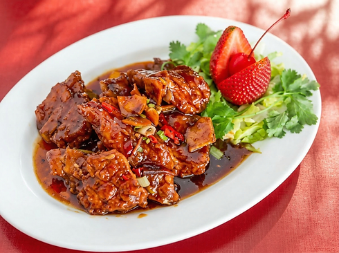 Chicken in dark sauce with strawberry and herbs