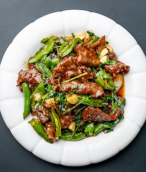 Beef and green peppers on a white plate, Lao Sze Chuan Pittsburgh dish.