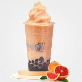 Grapefruit boba smoothie with tapioca pearls and sliced fresh grapefruit.