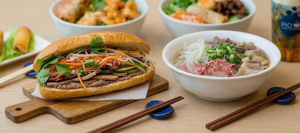 Vietnamese meal with bánh mì, pho, and noodle bowl