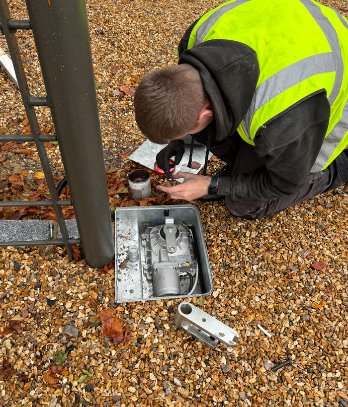 Fortline engineer servicing an underground gate motor