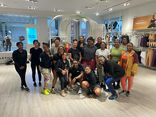 Fit Factory members and coaches together after a community workout at Fabletics