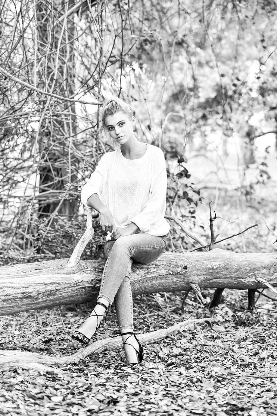 Artistic and natural senior portrait in the woods