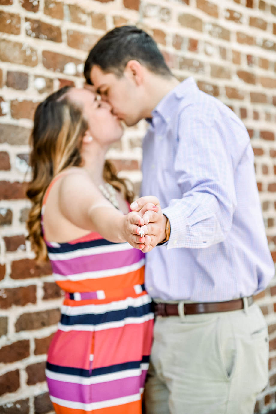 Passionate couples portrait in vibrant downtown setting