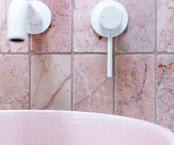Rosetta stone feature bathroom interior with tailored storage, Melbourne by Brinnie T Design.