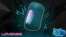 Illustrated promotional image of the Lovense Gush 2 penis massager shown against a dark teal background with stylized vibration effects surrounding the device. The Lovense logo appears in the bottom left, while the Boys Love Universe logo is displayed in the bottom right. The image emphasizes the product's compact design and vibration features.