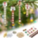 Christmas ornaments with names and words on a tree. Background of lights. Includes supplies like bows, letter tiles, and festive charms.