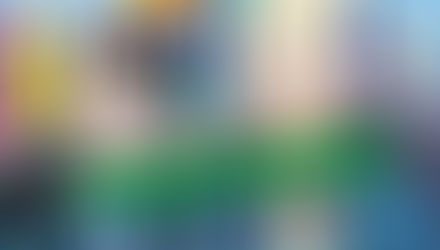 Promotional image for Boardwalk Dad Detox Kickstarter, featuring Wagner and Jackie from the adult animated film. Wagner, with black hair in a suit, looks serious, while Jackie, blond and wearing a blazer, appears tired and stern. The psychedelic rainbow background with dripping paint highlights the film’s surreal style. Bold green text reads “Kickstarter,” with the Boys Love Universe logo in the corner.