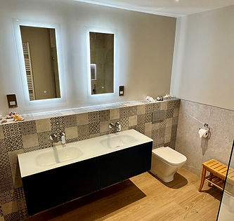 Bathroom tiling and double vanity unit.