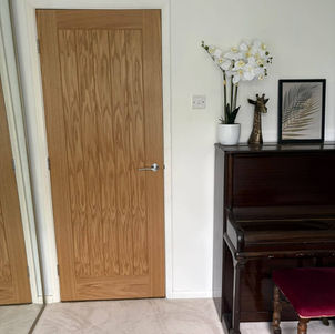 Wooden interior door beside a hallway console table
