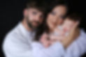 Proud mother and father holding their bran new baby girl