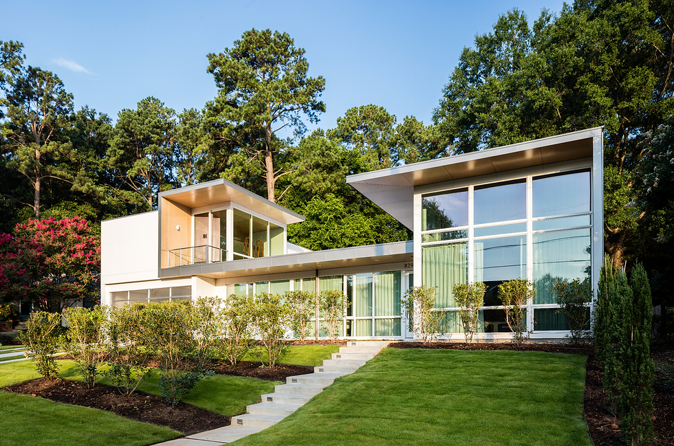 modern architecure, glass house, flat roof, modern house with a clear blue sky and green trees, concrete stairs with a grassy lawn