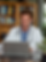 imgi_4_d2ofus_A_happy_doctor_looking_at_his_finances_on_his_notebook_7c670bf6-3c15-4fcb-bb