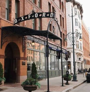 Historic elegance meets modern charm at the entrance of The Oxford Hotel, showcasing its iconic architecture and welcoming atmosphere.