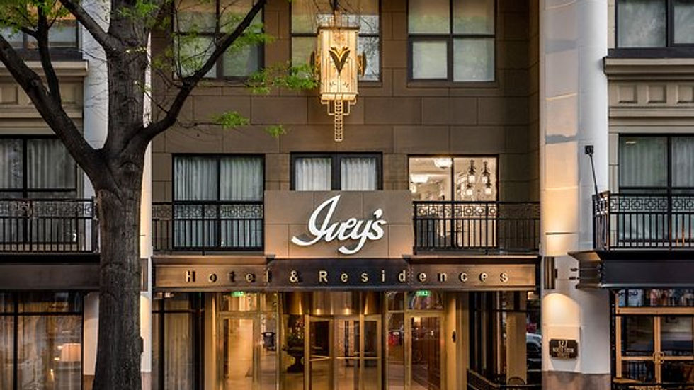 The elegant entrance of The Ivey's Hotel and Residences, showcasing its sophisticated facade and welcoming ambiance.