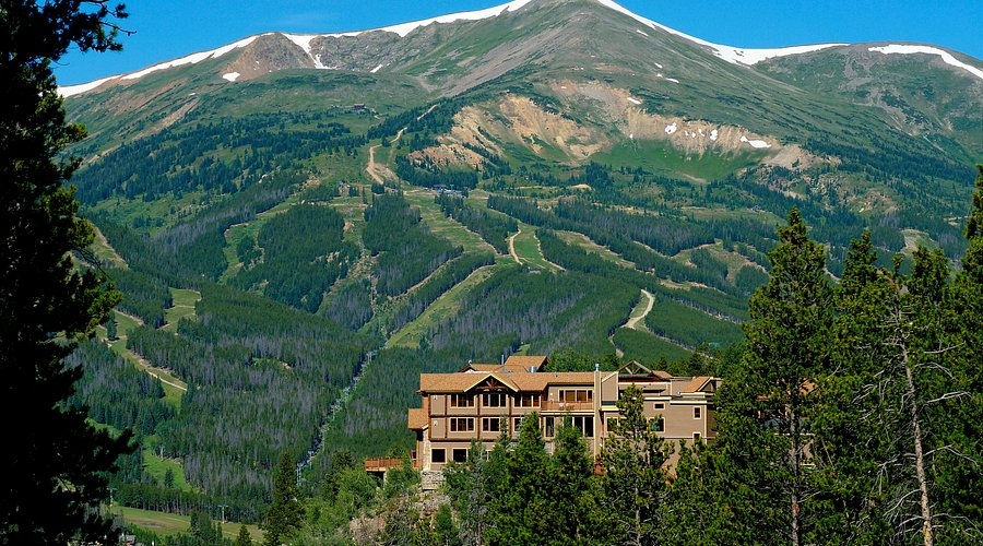 Nestled amidst the breathtaking Rocky Mountains, The Lodge at Breckenridge offers stunning panoramic views of lush forests and towering peaks.