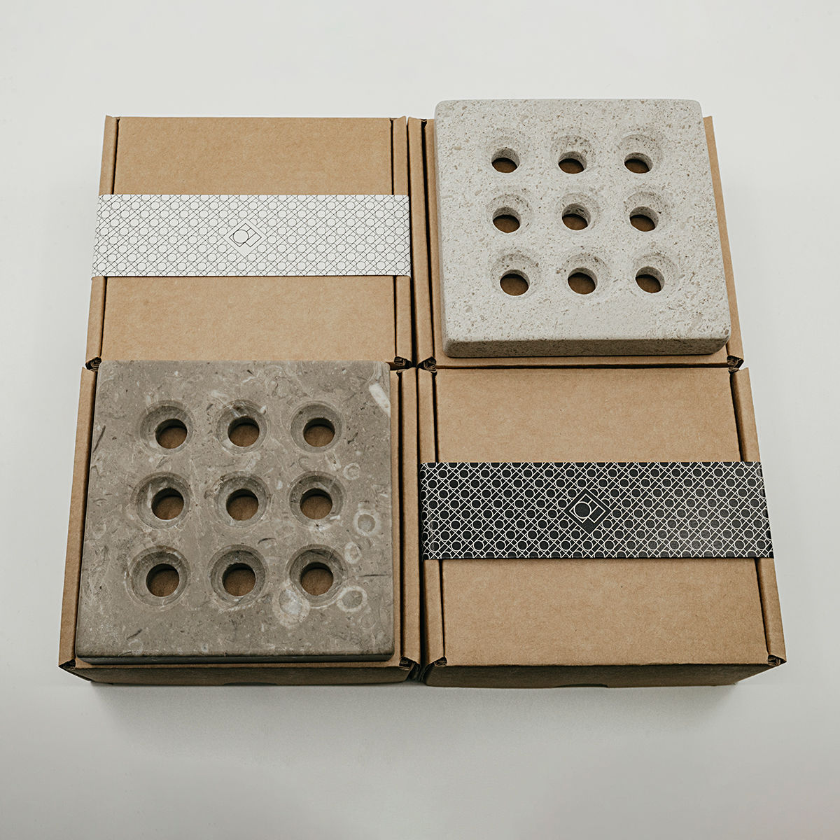 handmade stone soap holder or trivet in two variations - dark grey with fossils and light gray