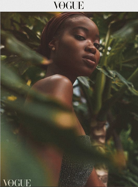 Photo published in Vogue Portrait of an african american women surrounded with green plants