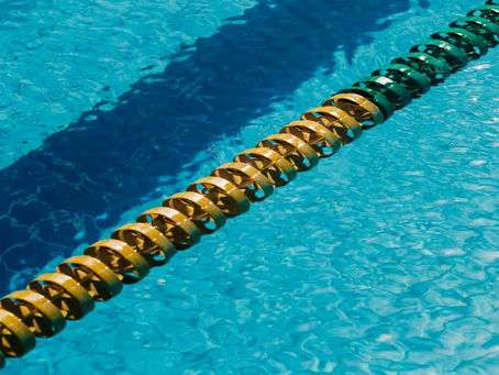 yellow and green lane divider in blue pool