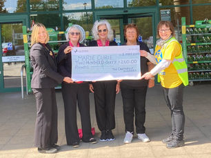 Cantabile presenting their donation to Marie Curie