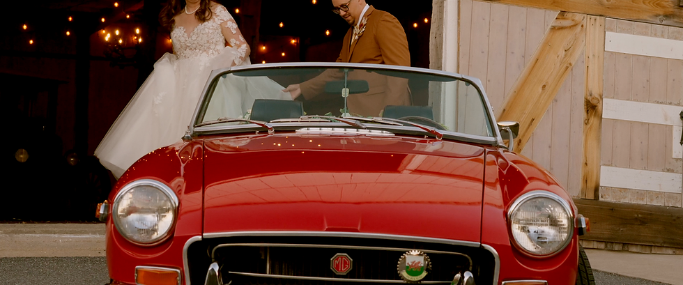 bride and groom with classic car.