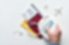 new-normal-travel-during-covid19-restrictions-flat-lay-white-background-hand-hold-german-p