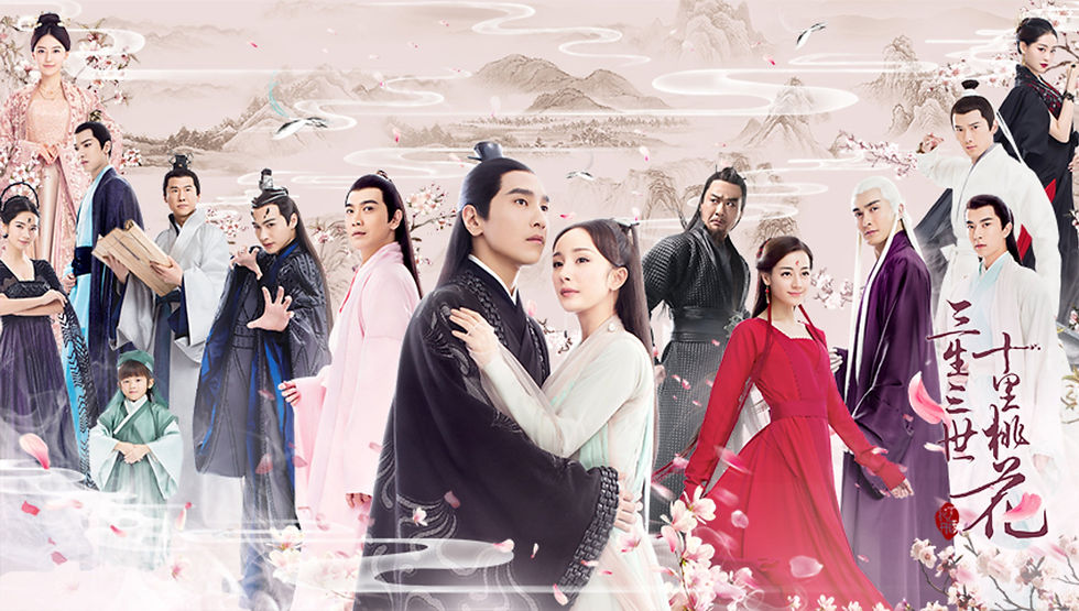 A group of people in historical attire stand against a serene landscape. Prominent are a couple embracing. Cherry blossoms and dramatic poses set a mystical mood.