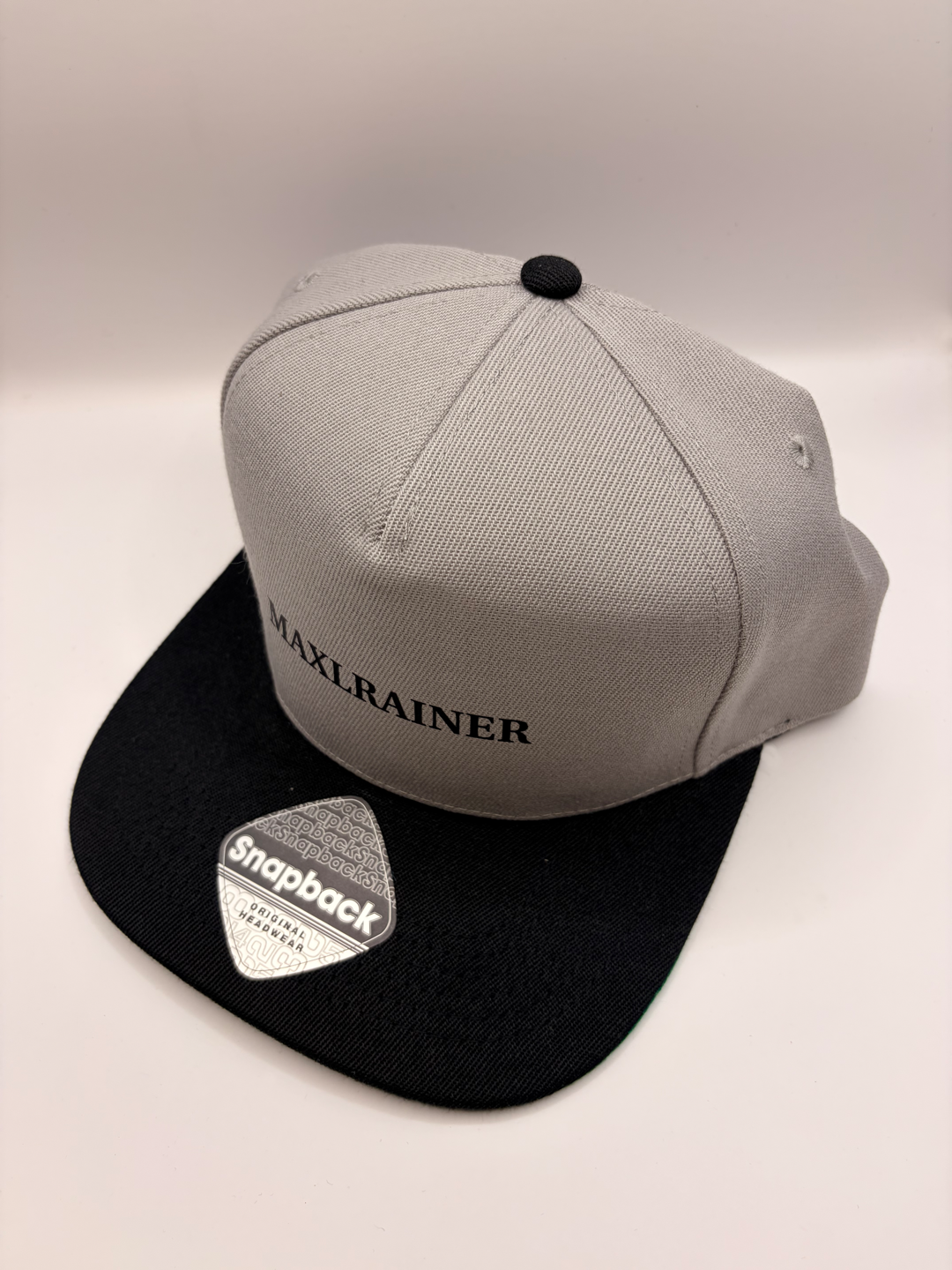 Snapback Cap "MAXLRAINER" in grau