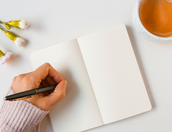 woman-writing-with-pen-blank-page-against-white-background.jpg