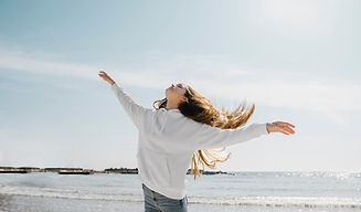 young-woman-enjoying-ocean-breeze_23-2148943464.jpg